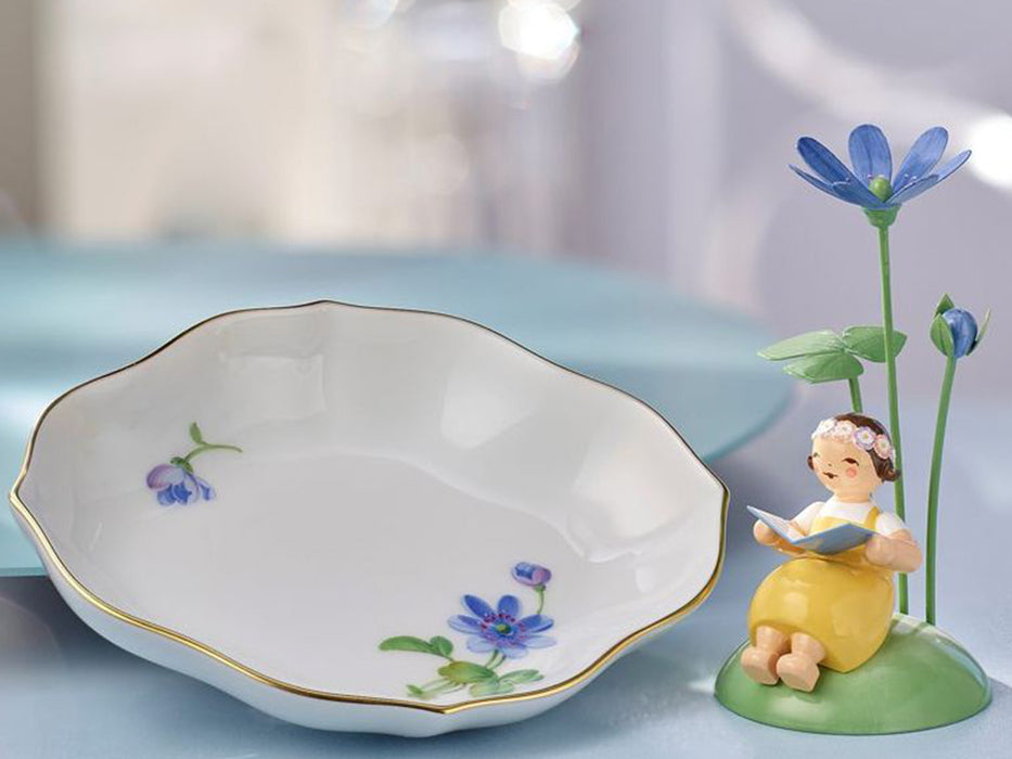 Girl with marsh marigold & bowl of Meissen porcelain